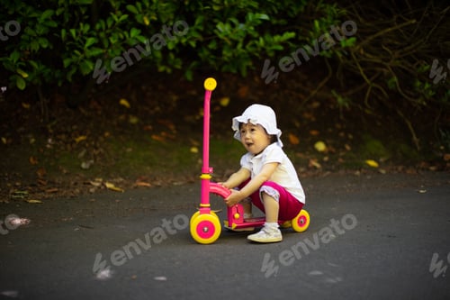 Preview: Baby Girl Play Balance Scooter At Summer Park