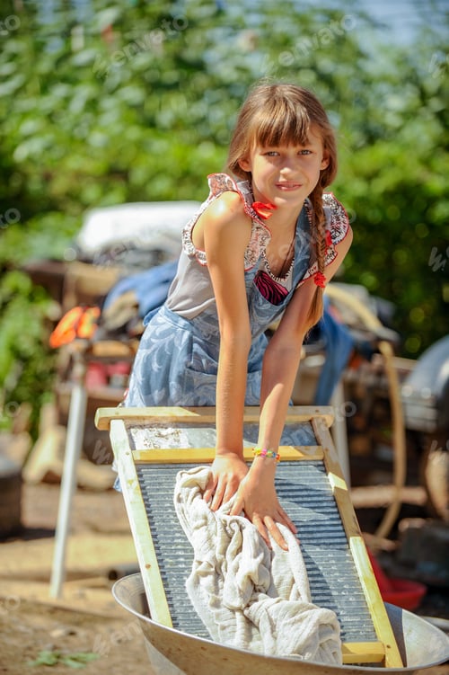 Preview: Farmer'S Daughter Is Washing His Father'S Shirt In Yard. Chicken Farm