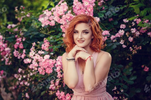 Preview: Lovely Young Woman In A Pink Dress And Red Hair, Waiting For A Date. A Walk Through The Summer