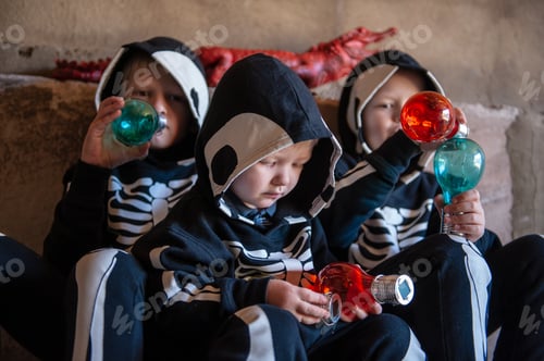 Preview: Happy Children In Carnival Costumes, Boys With A Red Crocodile In The Garage. Black Suit With The
