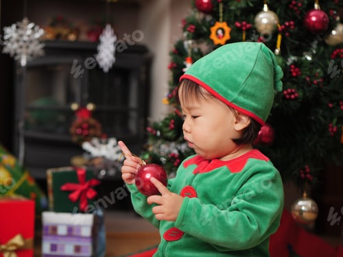 Preview: Baby Girl Decorating Christmas Tree