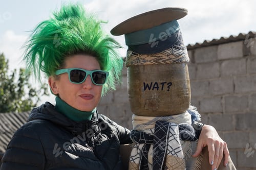 Preview: Caucasian Girl With Green Hair On The Farmyard Of A Village House. Copy Space.