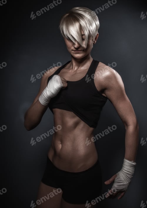 Preview: Sporty Athletic Woman Posing On Dark Background