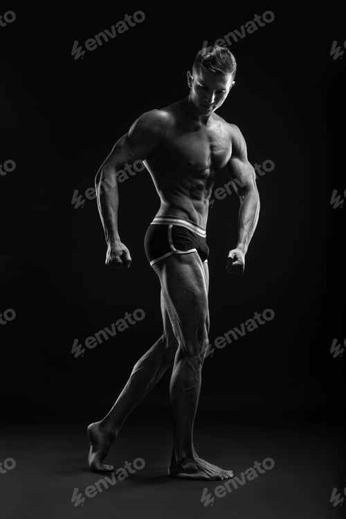 Preview: Bodybuilder Man Posing, Showing Perfect Abs, Houlders, Biceps, Triceps, Chest.