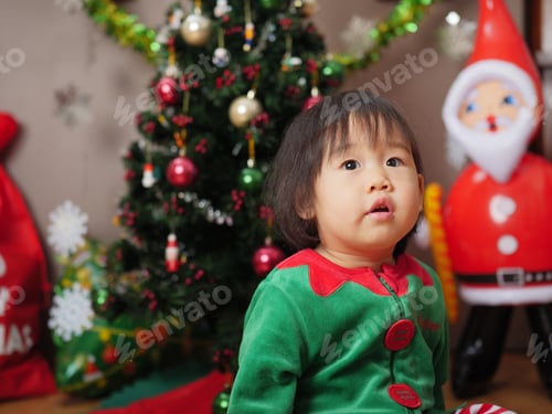 Preview: Baby Girl Decorating Christmas Tree