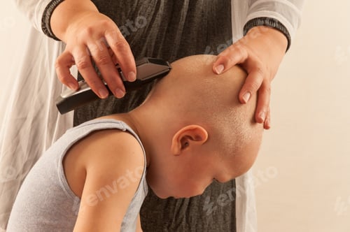 Preview: The Girl Cuts The Head Of The Little Boy With An Electric Hair Clipper. Emotions.