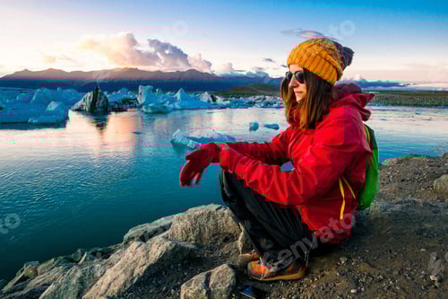 Preview: Woman In Bright Red Sport Jacket Near The Glacier Lagoon, Iceland