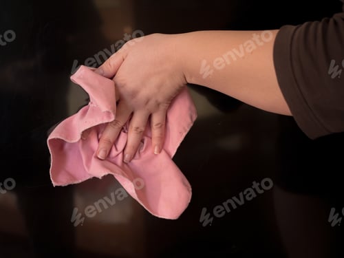 Preview: Happy Woman Housewife Wipes Tv Screen From Dust. Hand With Napkin Close-Up
