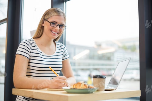 Preview: So Busy. Joyful Nice Smart Woman Sitting In The Cafe And Having Lunch While Working