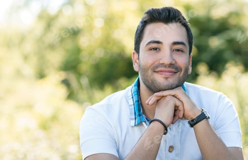 Preview: Close Up Of Handsome Latin Man. Portrait Of A Young Man In A Nature. Daylight