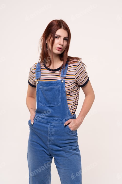 Preview: Young Beautiful Girl Is Standing In Blue Overalls