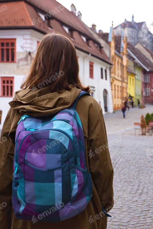 Preview: Girl Hipster Walking At The Beautiful Street In The Old Town Of Sighisoara, Romania