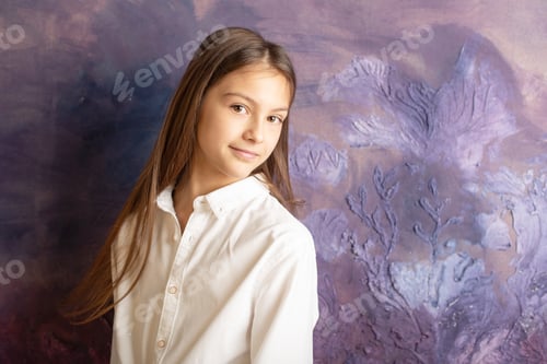 Preview: Pretty Teenage Girl Brunette With Long Hair Stands Against A Purple Wall, The Concept Of Youth And