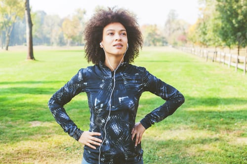 Preview: Sporty African American Woman Listening Music After Exercise In Park And Ready For Continue.
