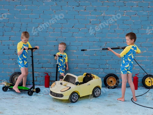 Preview: Funny Children In Boys' Bathing Suits Posing In Front Of Camera With High-Pressure Car Wash And Toy