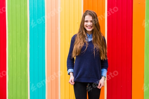 Preview: Very Beautiful Girl On A Background Of Colorful Wall