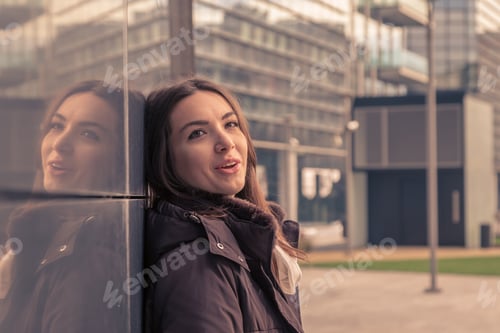 Preview: Young Beautiful Girl With Long Hair Posing In The City Streets