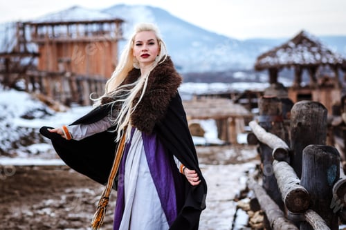 Preview: Beautiful Young Woman Holding A Viking With Blond Hair. Image Of Historical Figure