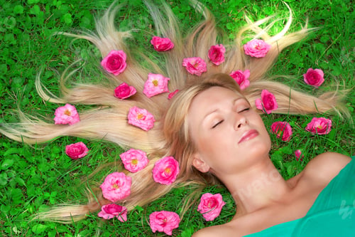 Preview: Beautiful Woman Relax On Grass With Flower All Around Head.