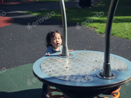 Preview: Baby Girl Playing In The Playground