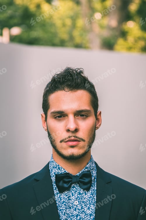 Preview: Young Handsome Man With Short Hair Wearing A Bow Tie And Posing In The City Streets