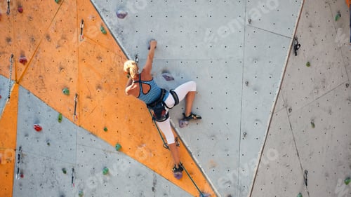 Preview: Bouldering, Girl Climbing Up The Wall