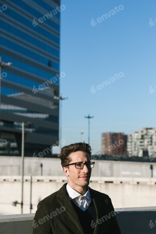 Preview: Young Handsome Man With Short Hair Posing In An Urban Context