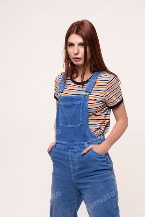 Preview: Young Beautiful Girl Is Standing In Blue Overalls