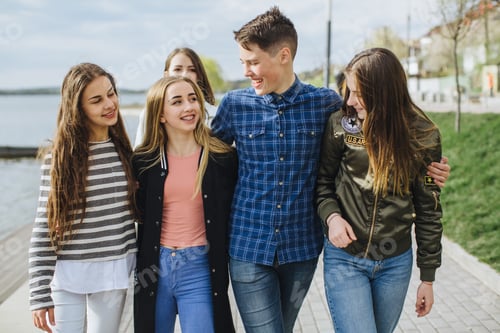 Preview: Summer Holidays And Teenage Concept - Group Of Smiling Teenagers Hanging Outside