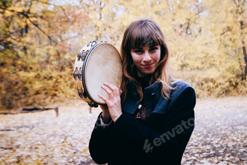 Preview: Autumn Portrait Of Dancing Woman With A Tambourine