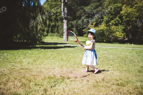 Preview: Toddler Girl Playing In Summer Garden