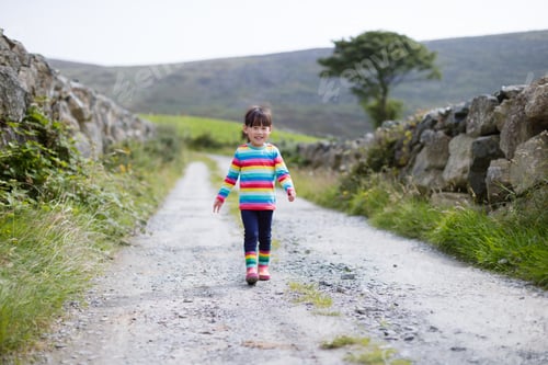Preview: Young Girl Walking On Summer Countryside Road