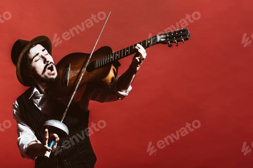 Preview: Positive Guy Playing The Guitar And Posing