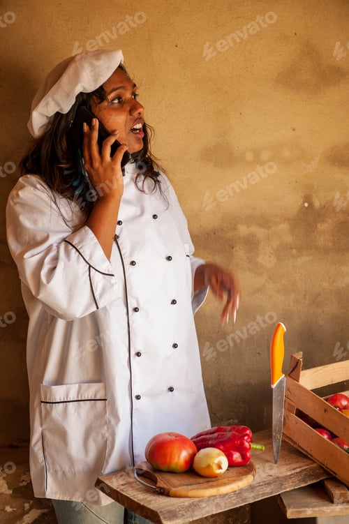 Preview: Attractive Indian Woman Cook Talking On Smartphone. Closeup Portrait Of Young Pretty Woman
