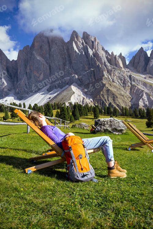 Preview: Relax - Girl Is Resting In A Chair At The Mountains. Puez Odle Dolomites, Italy.