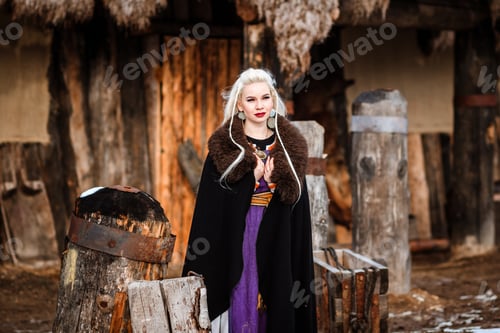 Preview: Beautiful Young Woman Holding A Viking With Blond Hair. Image Of Historical Figure