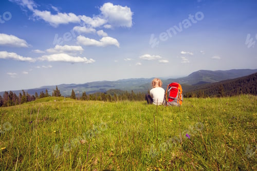 Preview: Girl Hiker With A Backpack Sitting On The Background Of Mountains And Forests. Vorokhta - Ukrainian