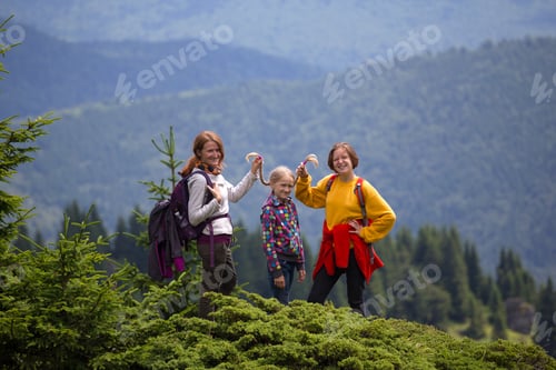 Preview: Happy Family In The Mountains. Mother With Daughters Are Walking In The Mountains