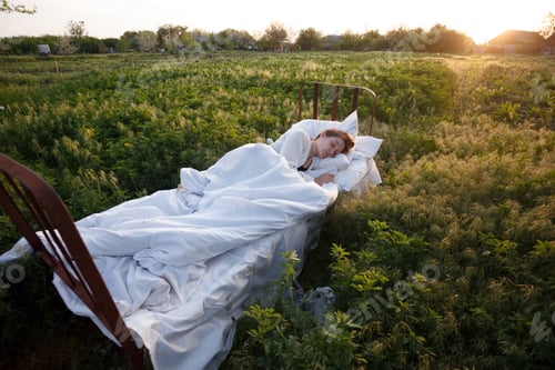 Preview: Girl Sleeping In The Bed In A Green Field. Healthy Sleep In Nature