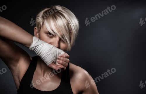 Preview: Portrait Of A Sports Woman Showing Her Fist Or Hand In Bandage