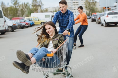 Preview: Boy Inside Supermarket Cart With Girl.