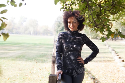 Preview: Portrait Of Happy Fitness African Woman Relaxing After Jogging At Park In The Morning. Copy Space