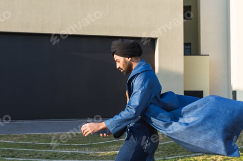 Preview: Handsome Indian Man Posing In An Urban Context. Street Fashion And Style.