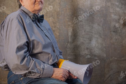 Preview: Beautiful Senior Woman Is Excited, Euphoric, Screaming With Megaphone, Sign Of Revolution And