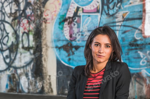 Preview: Beautiful Young Brunette With Long Hair Posing In An Urban Context