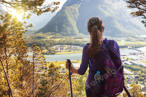 Preview: Girl Hiker With A Backpack And Trekking Pole Sitting And Looking On Romsdalsfjorden And Andalsnes
