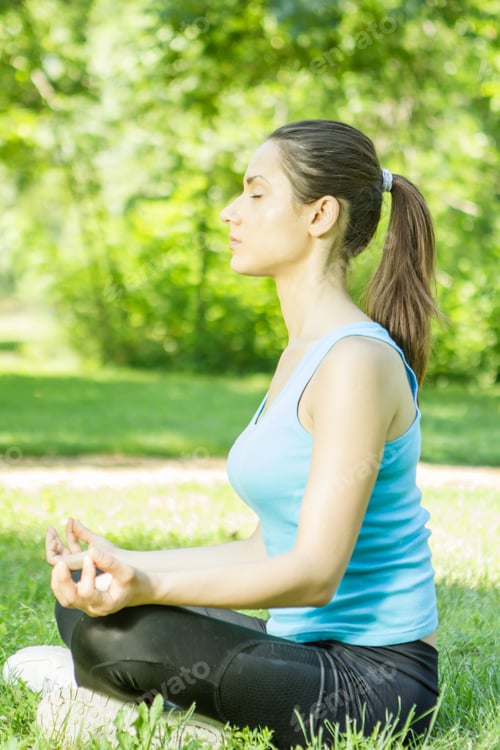 Preview: Beautiful Young Woman Doing Yoga In The Park.