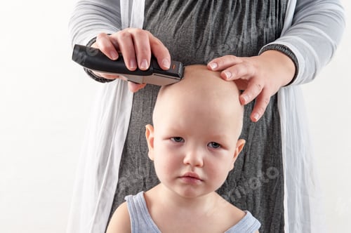 Preview: The Girl Cuts The Head Of The Little Boy With An Electric Hair Clipper. Emotions.