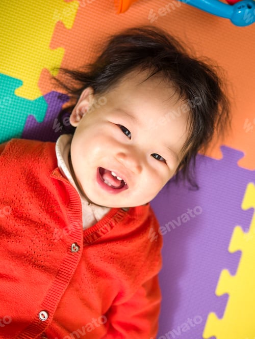Preview: Asian Baby Girl Lying On Play Mat