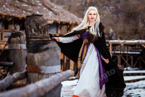 Preview: Beautiful Young Woman Holding A Viking With Blond Hair. Image Of Historical Figure